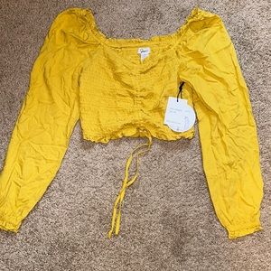 Yellow ruffled long sleeve crop top